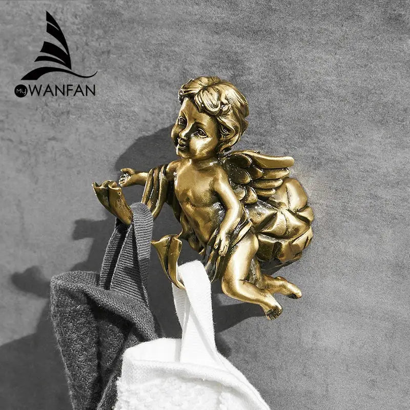 Golden angel brass towel hook with detailed wings and curly hair crafted from metal for bathroom and garage use