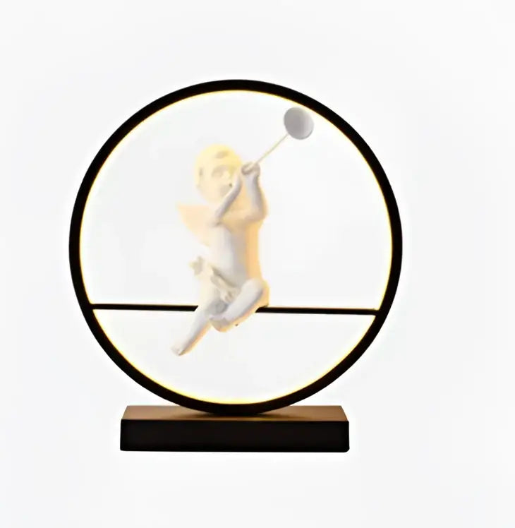 Decorbites angel doll bird table lamp with a white cherub figurine holding a tennis racket in a black frame