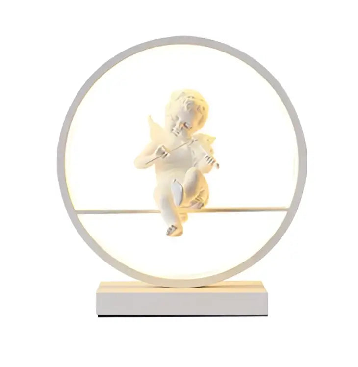 A white angel doll bird table lamp with a circular led light frame and minimalist base for romantic decor