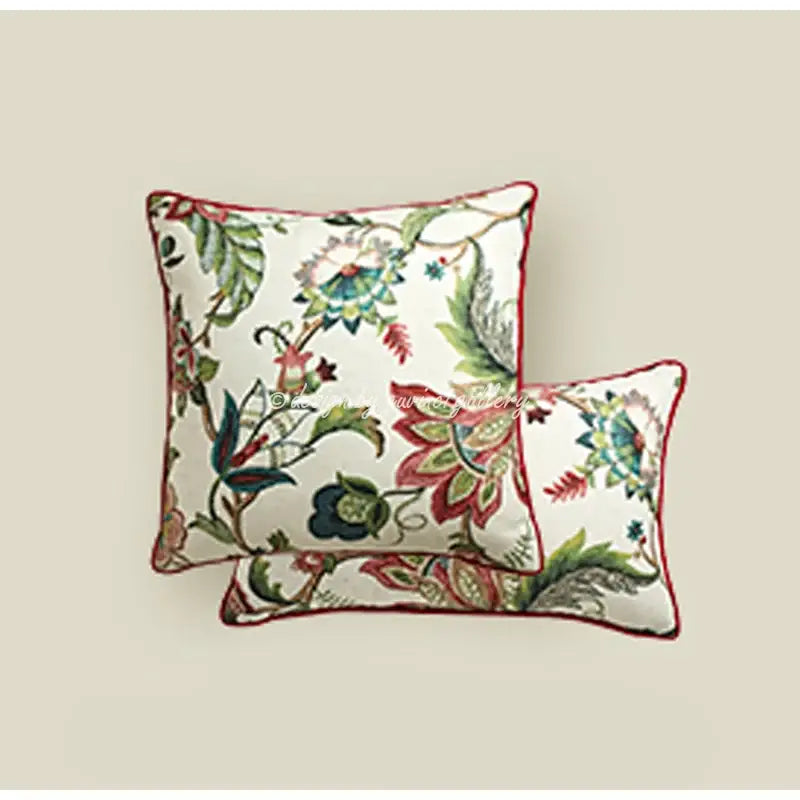 Square decorative pillow cover with intricate green red and blue floral embroidery and burgundy border for angel eyes lumbar