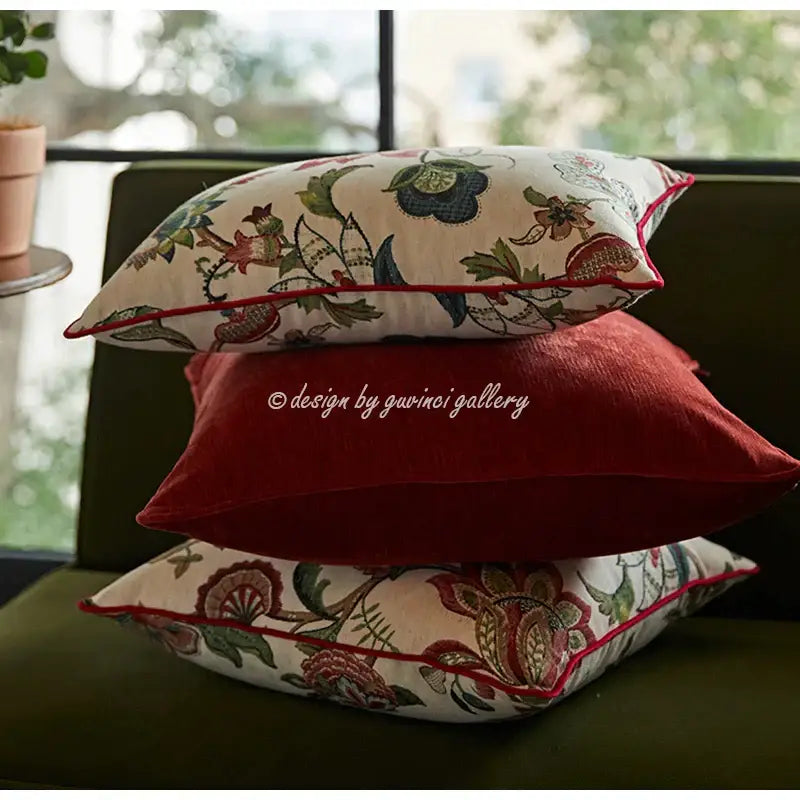 Stacked decorbites™ angel eyes lumbar pillow covers with cream base, floral embroidery, and bold red piping