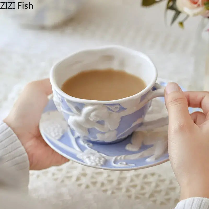 A delicate light blue ceramic teacup with white angel figures relief floral patterns from decorbites™ dining set