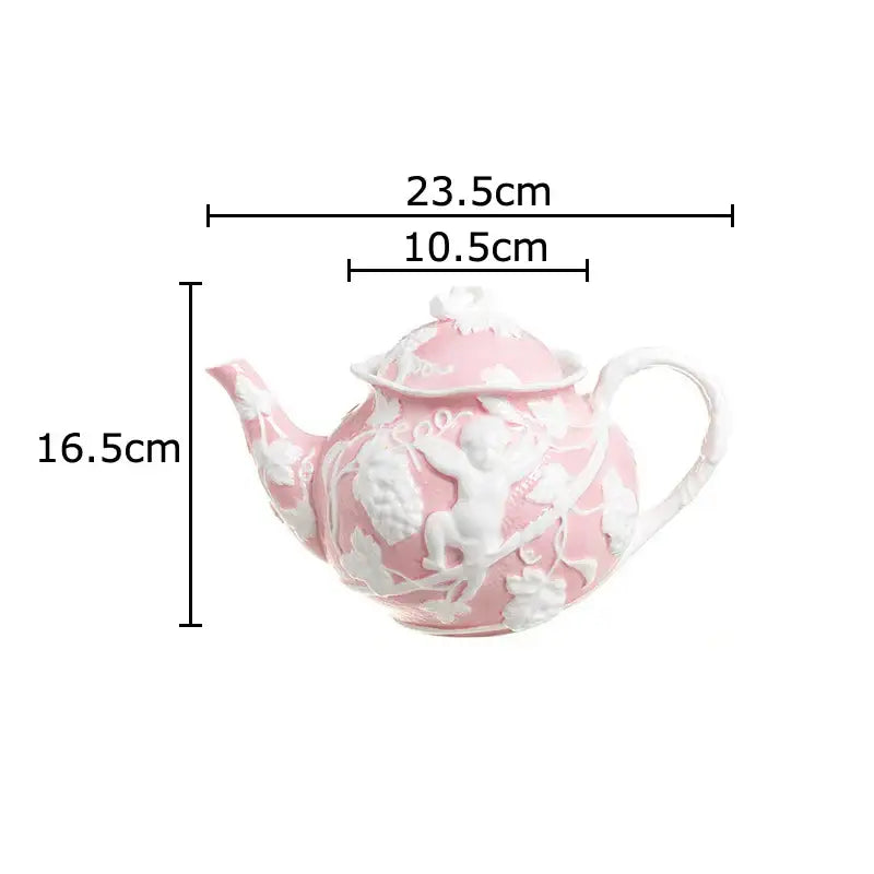 A delicate pink porcelain teapot with raised white angel figures relief and floral motifs from DecorBites™ collection