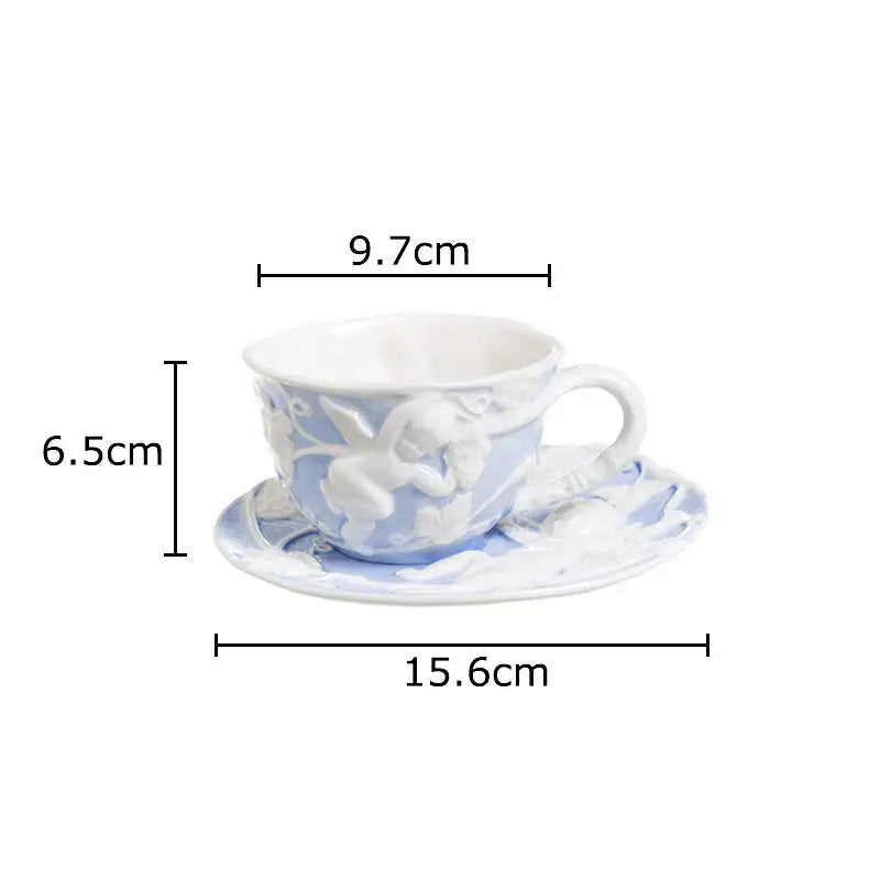 A light blue ceramic teacup with angel figures relief and matching saucer from decorbites™ ceramic dining set and mug collection