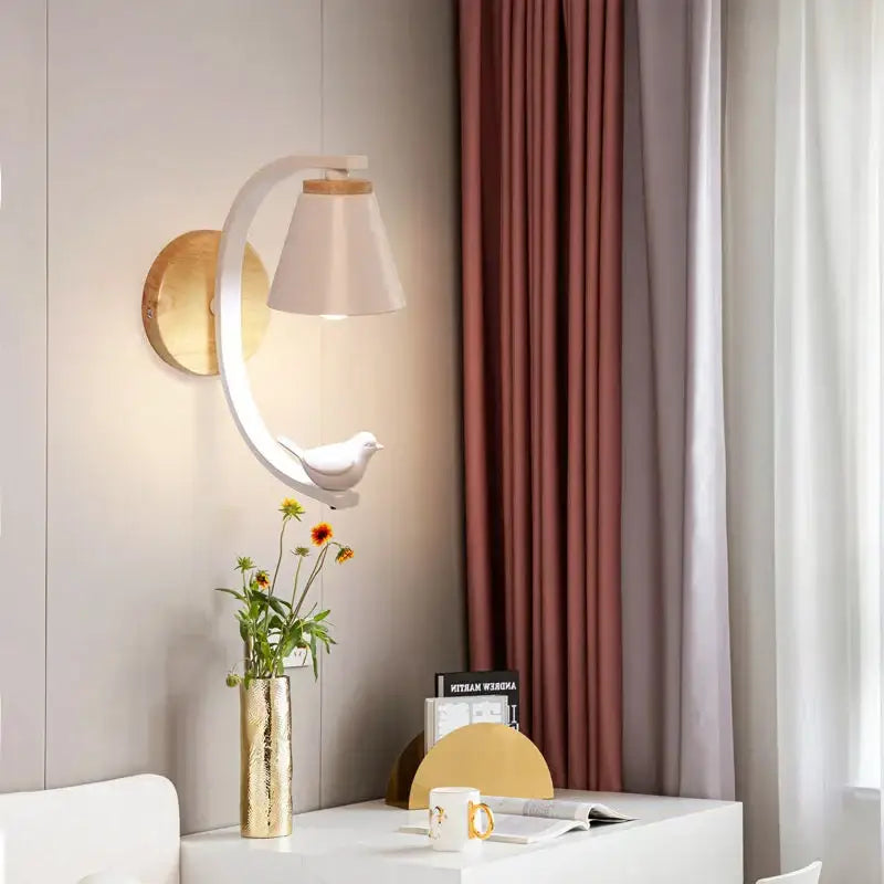 Decorbites™ angel girl bedroom wall sconce with white curved arm gold base beige shade and white bird sculpture