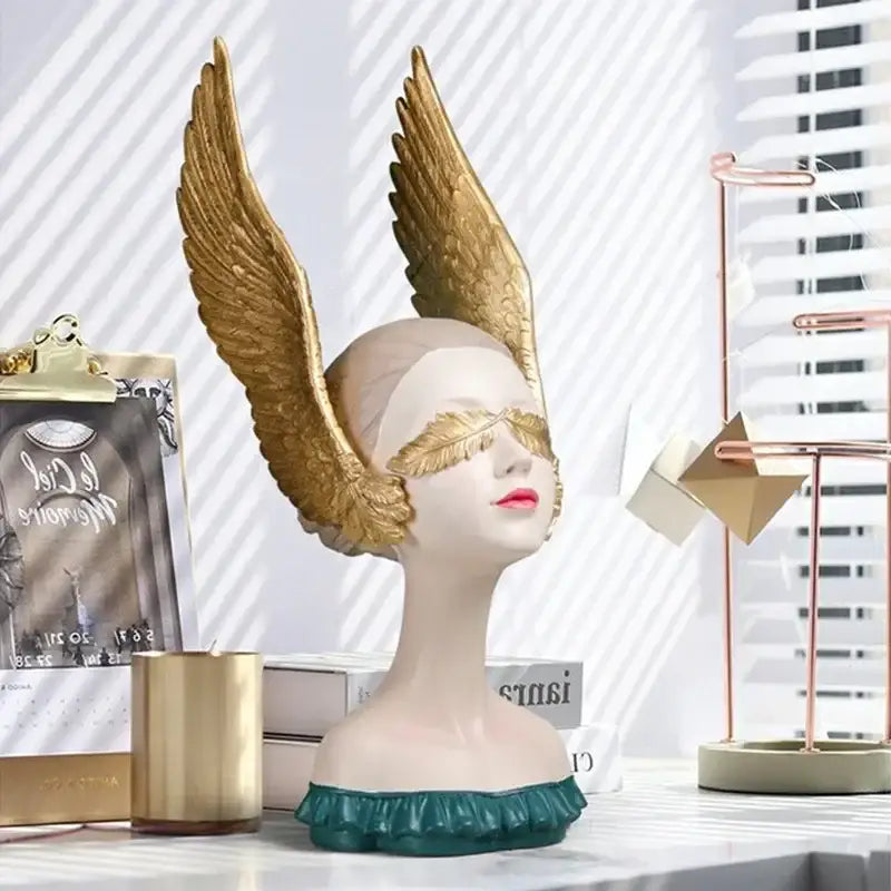 Decorbites™ angel girl statue with golden wings, pale face, red lips, and teal ruffled base for room decor