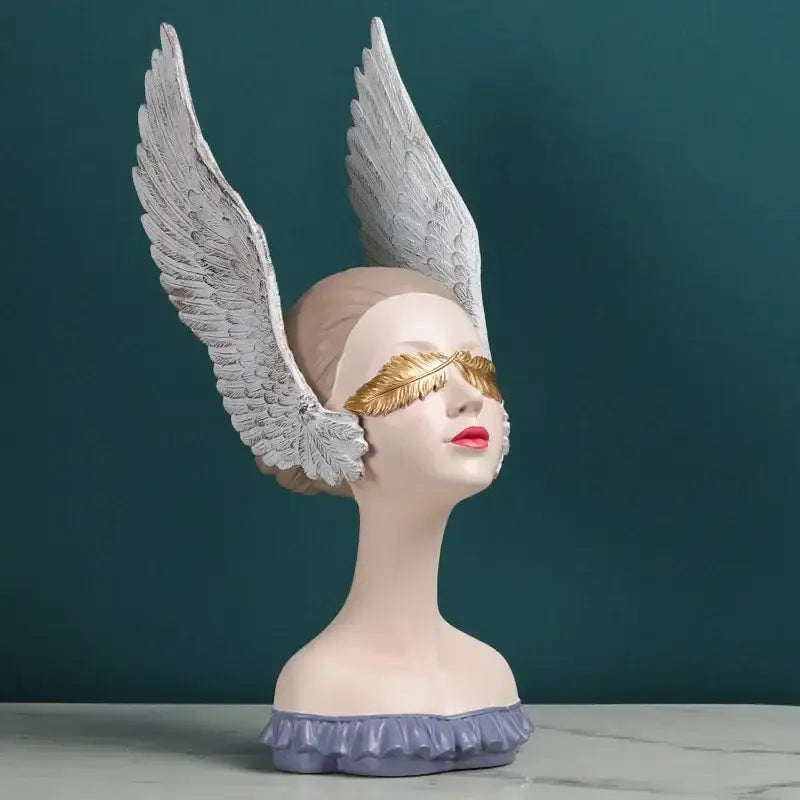 Decorbites angel girl statue with white wings, golden feather mask, red lips on lavender base for room decor and gifts