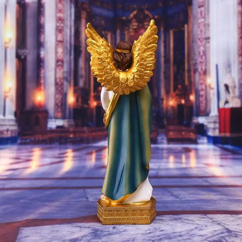 Golden-winged angel god statue figurine with teal and white robe standing on ornate golden base for home decor