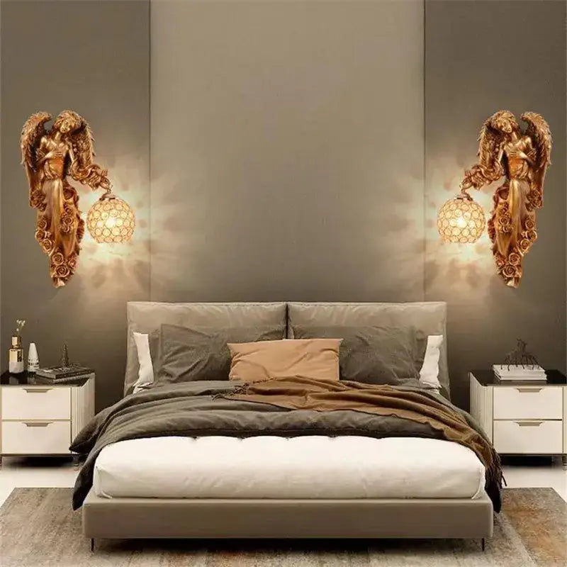 Gold resin DecorBites™ angel indoor wall light LED sconce with intricate wings holding honeycomb glass shade wall light