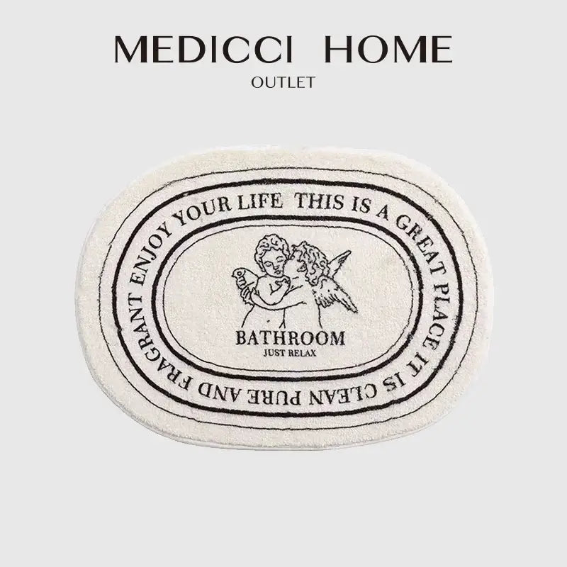 Cream-colored decorbites angel print shaggy bath rug 40x60cm with black embroidered cherubs and relaxing text design