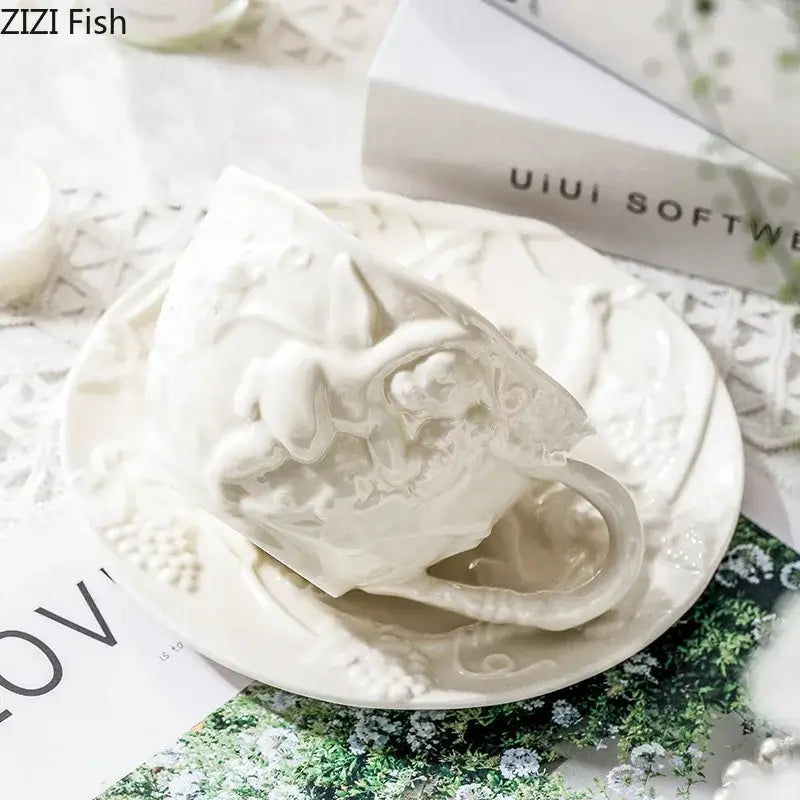 White ceramic teacup with intricate raised floral and vine detailing from decorbites angel relief ceramic tableware set