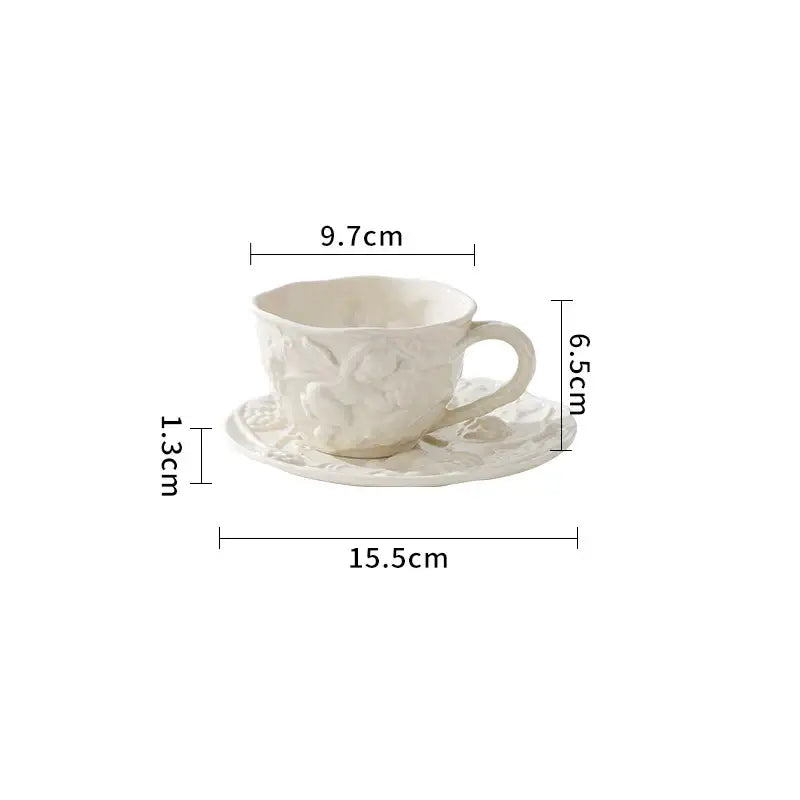 White ceramic teacup and saucer with delicate floral embossing from decorbites angel relief ceramic tableware set