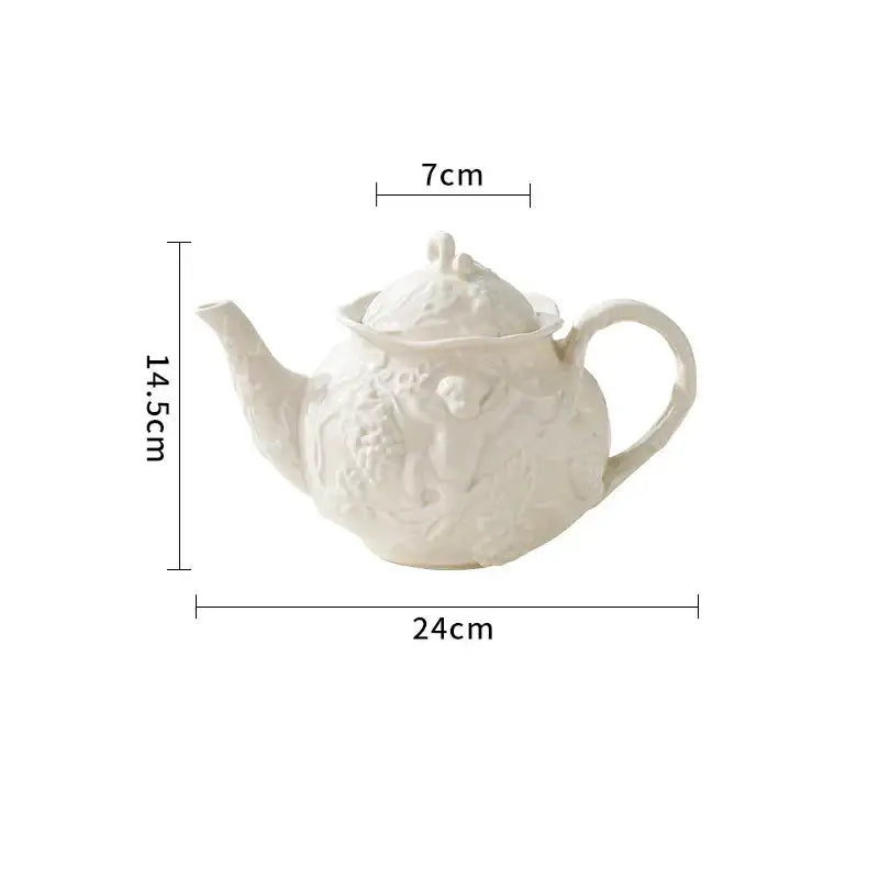 White ceramic teapot with intricate angel relief ceramic detailing and matching lid from decorbites relief ceramic tableware set