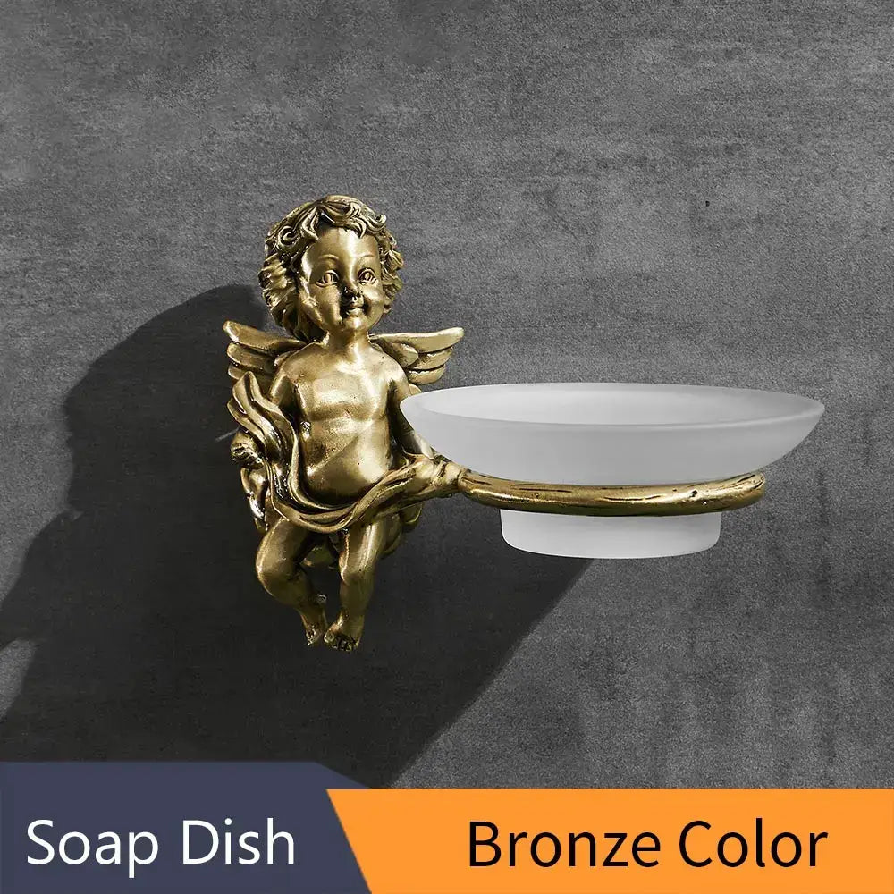 Decorbites™ angel style gold soap dish holder features a bronze angel figurine with a white ceramic bowl for bathroom wall mounting