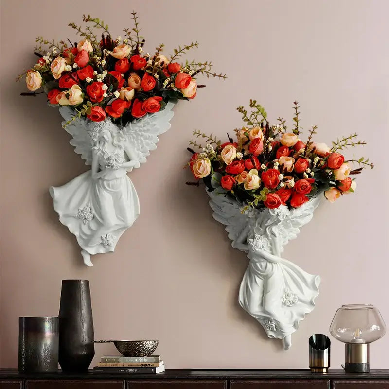 White angel-shaped resin wall decoration holding a bouquet of red and peach roses vase wall decoration