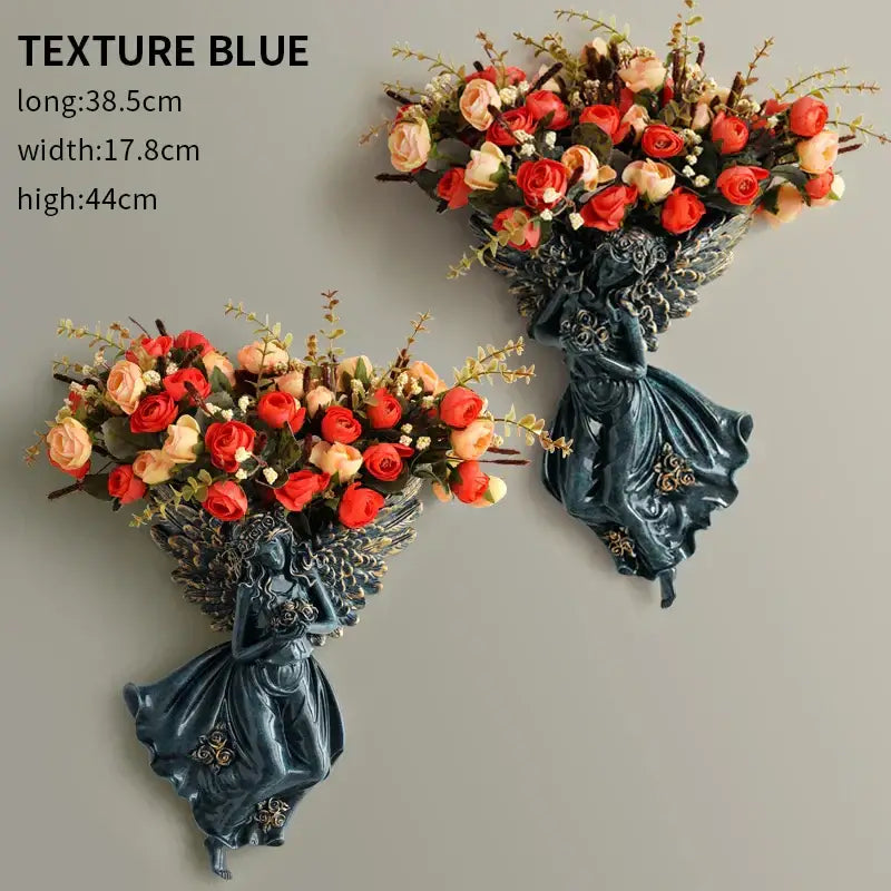 DecorBites™ dark blue resin angel vase wall decoration with intricate wings holding red and peach roses for living room
