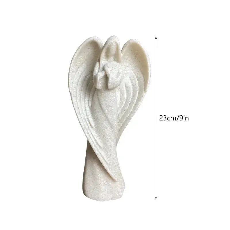 DecorBites angel wing girl resin statue is a white glittery resin statue with detailed wings for home decor