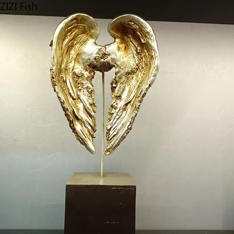 Decorbites™ golden angel wings sculpture with textured metallic finish on dark base for wings sculpture desk decor