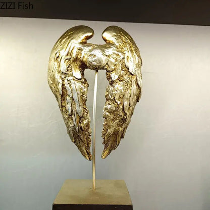 Golden angel wings sculpture with textured feather details and metallic finish decorative wings sculpture desk ornament
