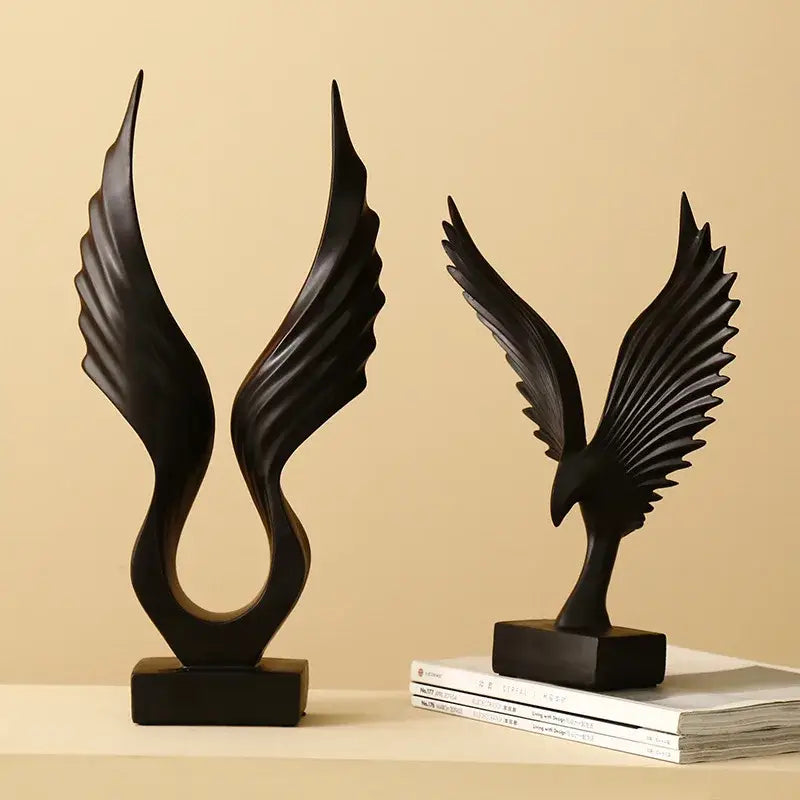 Black resin angel wings sculpture by DecorBites with detailed spread wings in nordic modern design