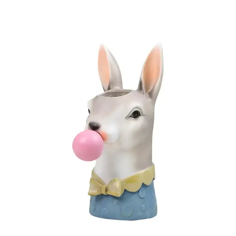 A hand-painted white rabbit animal bust succulent in resin with pink ears yellow bow tie and blue polka-dot attire blowing bubblegum