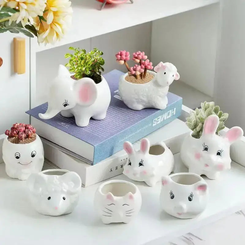 White ceramic animal cartoon ceramic flowerpots with pink accents and cute facial features for nursery planting