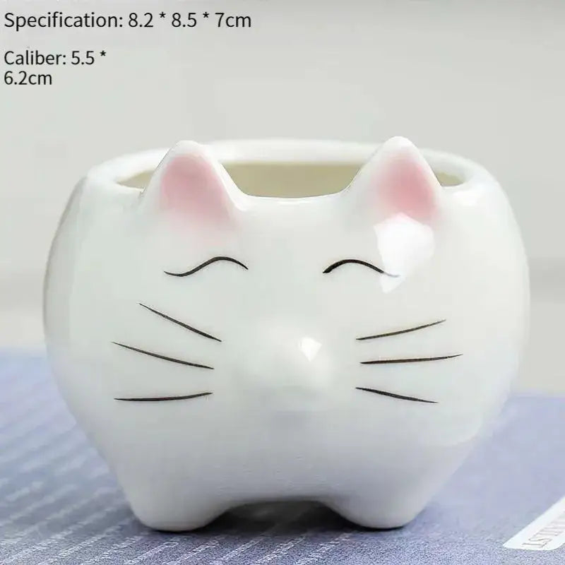 White ceramic animal cartoon planter with pink ears and black whiskers for nursery planting by decorbites