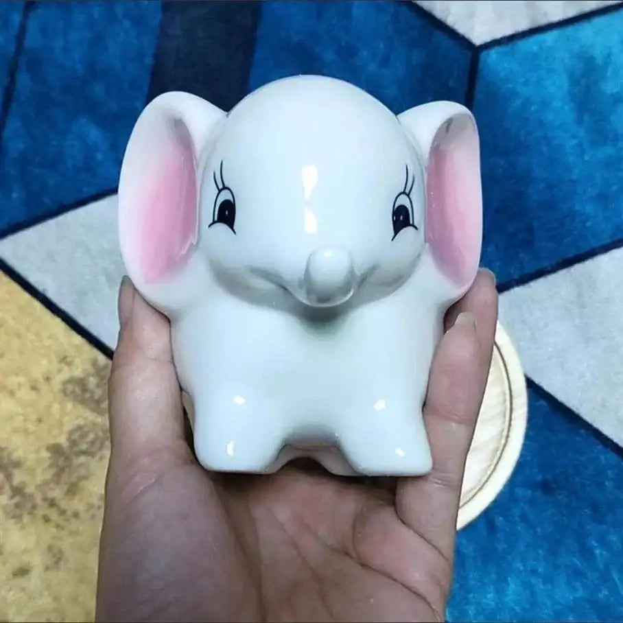 White ceramic elephant piggy bank with pink ears and black eyelashes in decorbites animal cartoon ceramic flowerpot design