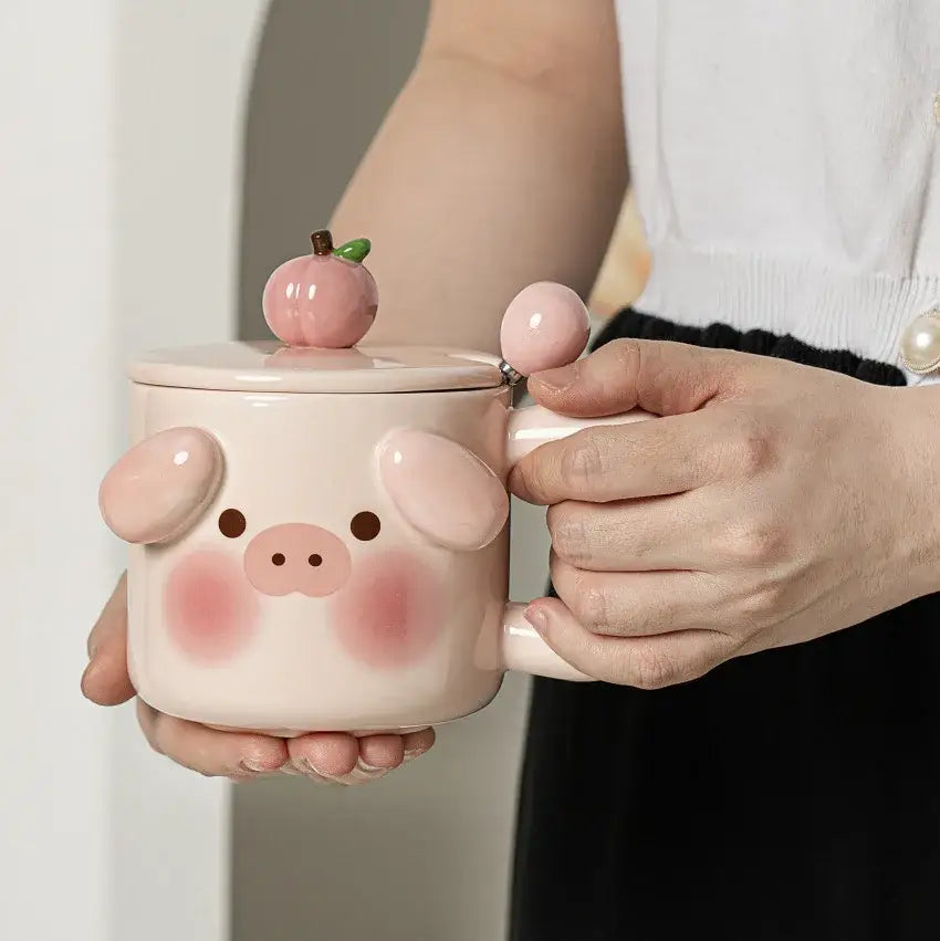Pink ceramic animal ceramic mug shaped like a pig with rosy cheeks and peach-shaped lid from decorbites ceramic mug set