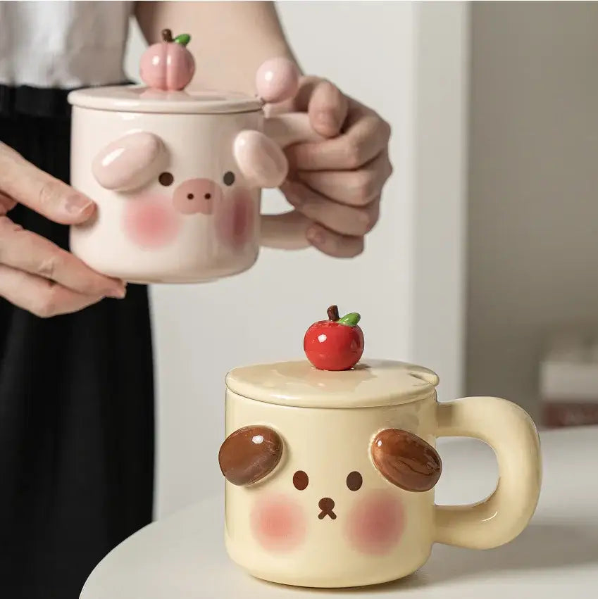 White ceramic animal ceramic mug with pig face and pink cheeks topped with peach-shaped lid from decorbites ceramic mug set