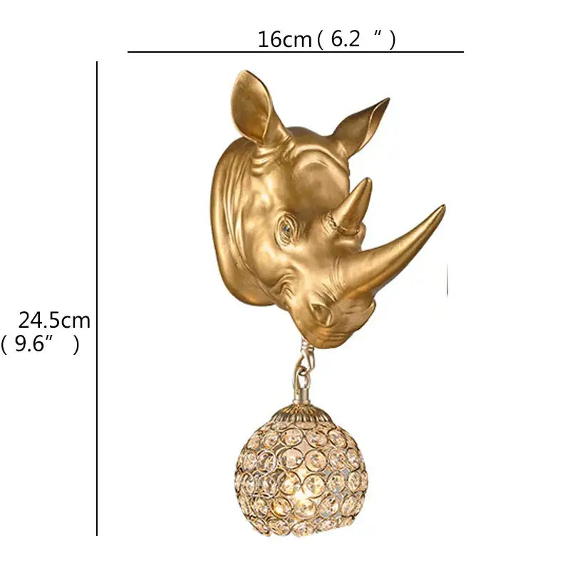 Gold-colored rhinoceros head sconce with dangling crystal globe led wall light for home bedroom decor by DecorBites