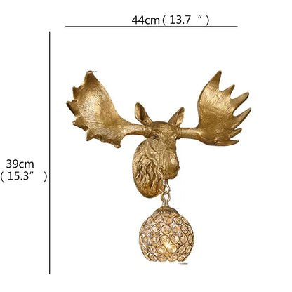 Golden moose head led wall light with ornate antlers and dangling crystal globe for home bedroom decor by decorbites