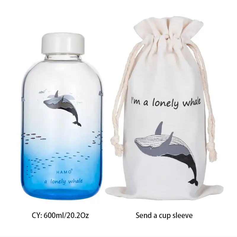 Clear glass water bottle with white cap featuring a gray whale design labeled a lonely whale by hamo for outdoor use