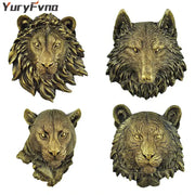 Bronze-colored resin decor featuring intricately detailed animal head wall hangers of lion wolf leopard and tiger