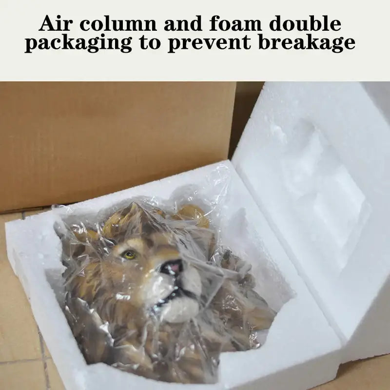 Decorbites™ animal head wall hanger featuring a lifelike golden-brown lion resin sculpture in protective foam packaging