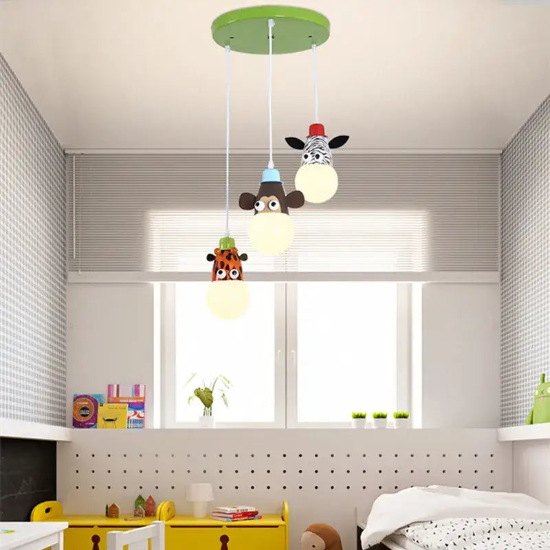 DecorBites™ animal led ceiling light features a green circular fixture with three dangling kid-friendly animal pendant lamps