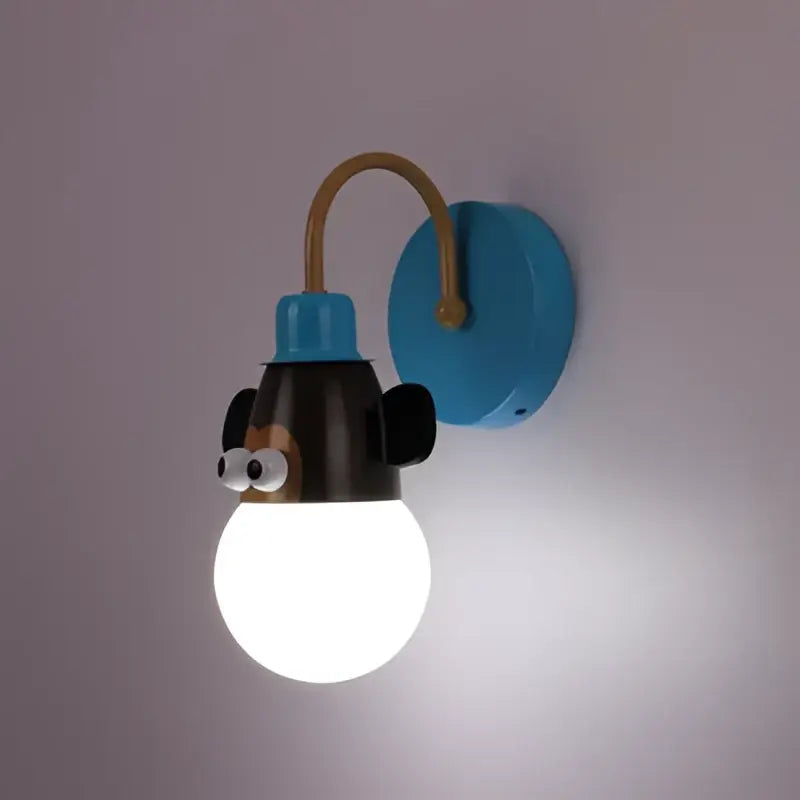 Blue wall-mounted monkey head led ceiling light with black ears and googly eyes for kids bedroom by DecorBites™