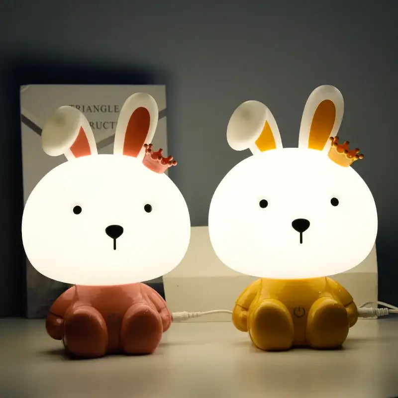 Two adorable decorbites™ bear rabbit led night lights with glowing bunny shapes in warm brown and sunny yellow colors