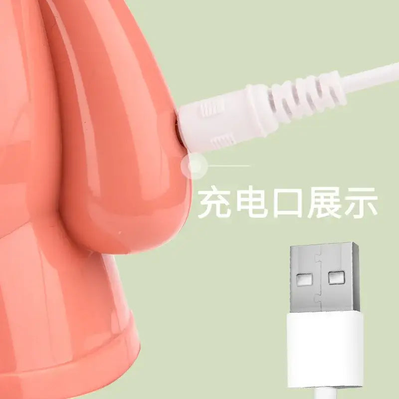 A peach-colored glossy plastic bear rabbit led animal light night light with usb charging port for bedroom and baby gift