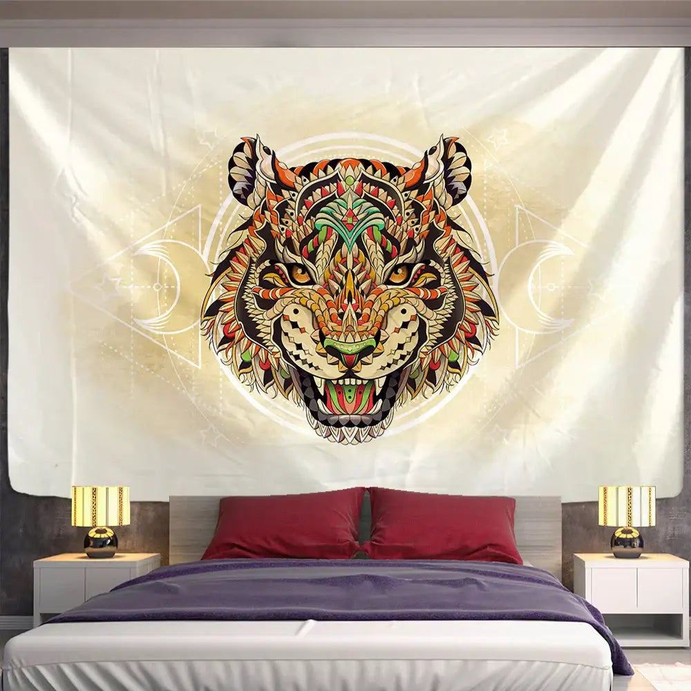 A vibrant orange green and black animal mandala tapestry with intricate tiger design hanging as wall decor above bed