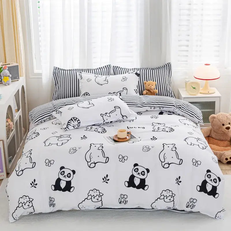 White duvet cover bedding set featuring black cartoon pandas sheep and bears in playful animal pattern style by decorbites