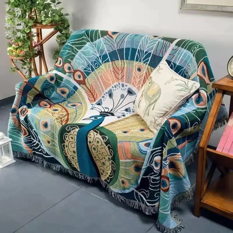 DecorBites™ animal pattern throw blanket with vibrant peacock design, tassels, and teal green gold cream colors