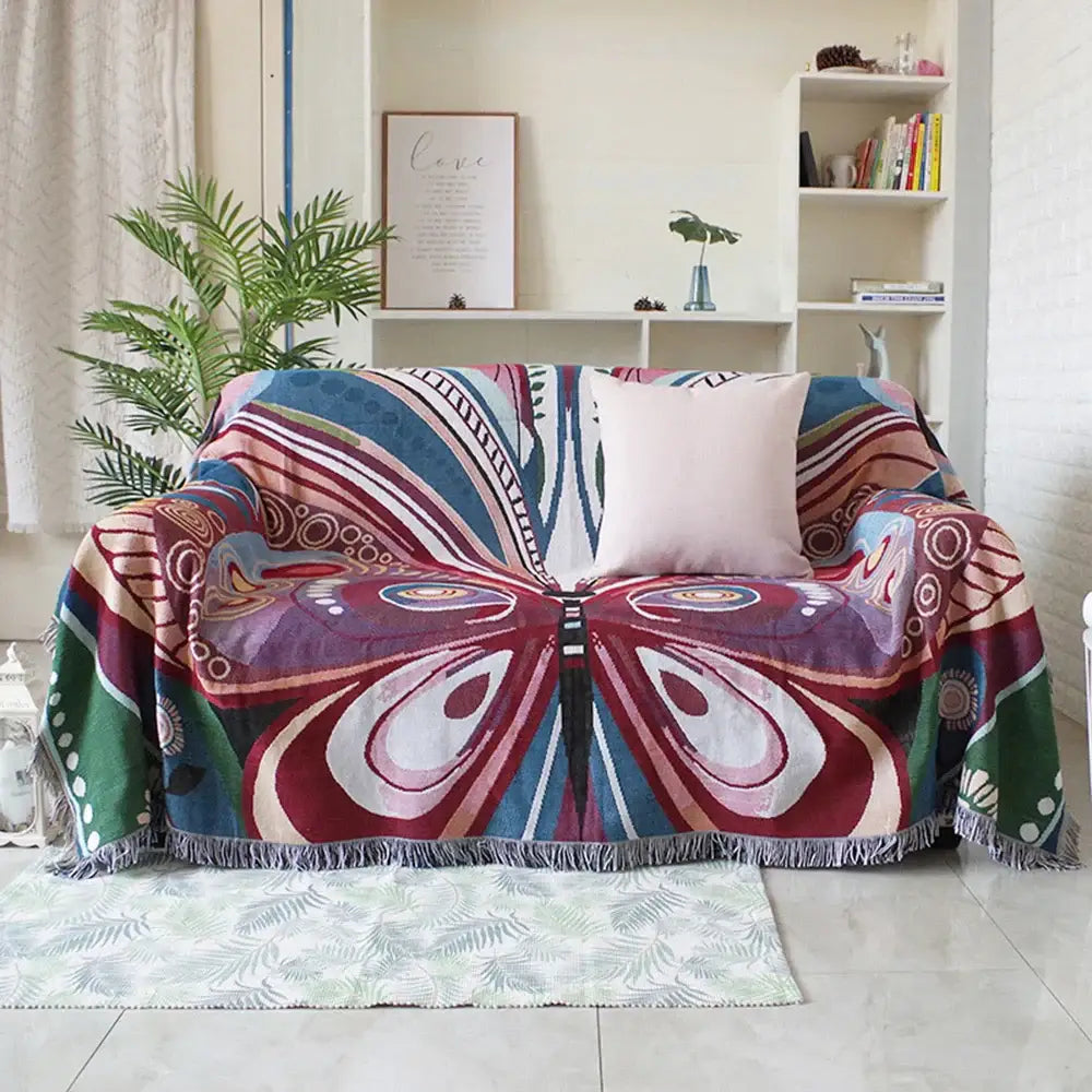 Vibrant multicolored decorbites™ animal pattern throw blanket with bold butterfly design and fringe tassels for sofa use