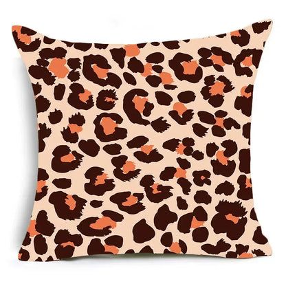 A square DecorBites™ animal print pillowcase cushion cover with bold leopard print in dark brown and orange on beige background