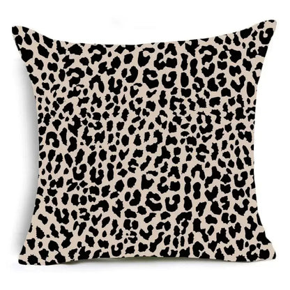 Beige animal print pillowcase with bold black leopard pattern for sofa decoration by decorbites™