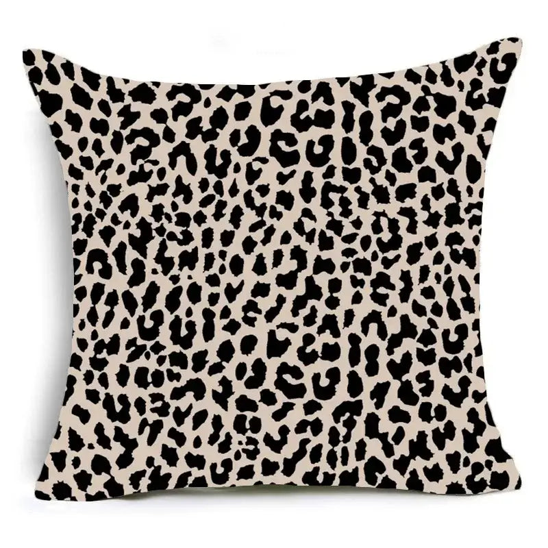 Beige animal print pillowcase with bold black leopard pattern for sofa decoration by decorbites™
