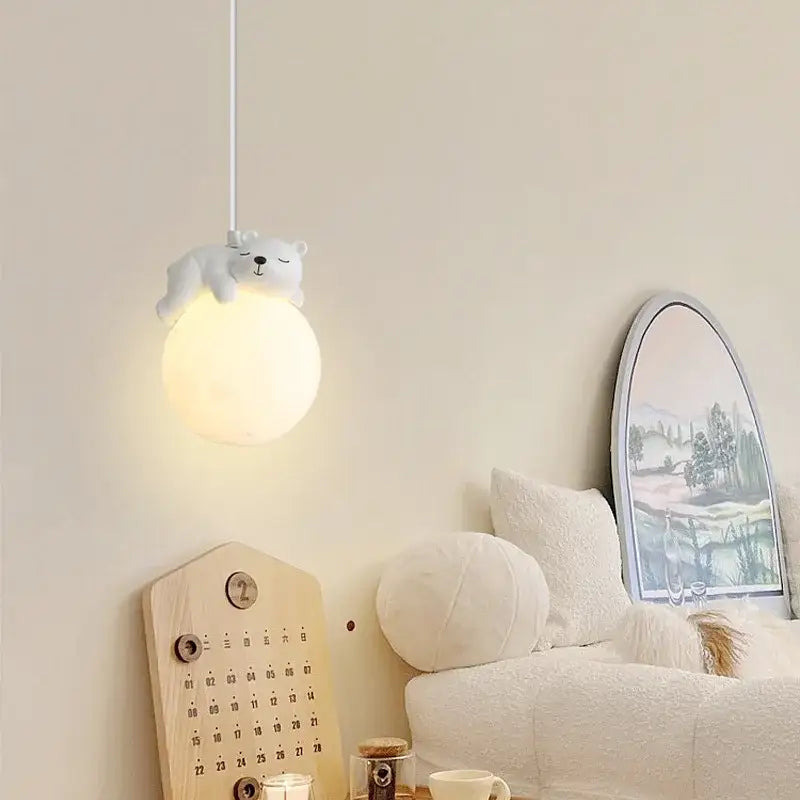 White polar bear-shaped resin pendant lamp with soft glowing spherical bulb for children’s room lighting decorbites pendant lamps