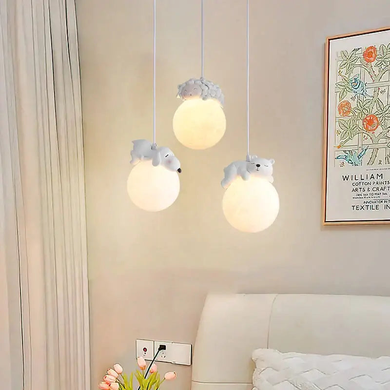 Three white spherical resin pendant lamps with gray plush bear accents from decorbites animal resin pendant lamps collection