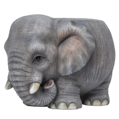 Gray elephant resin sculpture footstool seat with detailed textured skin small tusks and pink inner ear by DecorBites