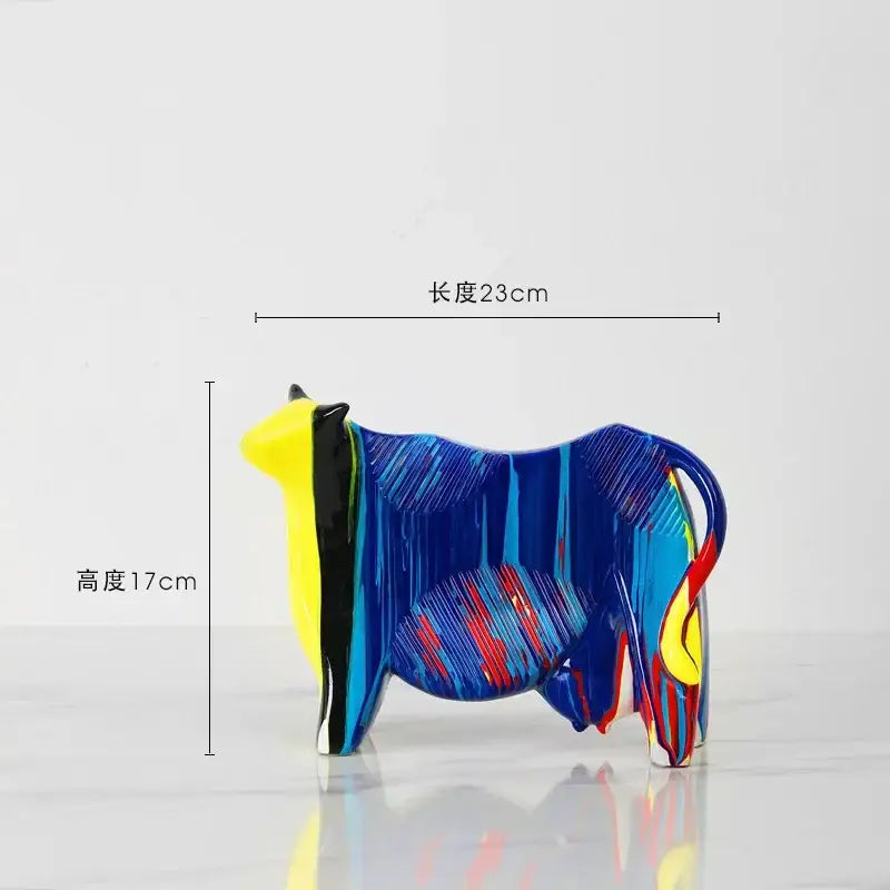 Vibrant blue yellow and red glossy glass animal resin statue from DecorBites resin statue collection